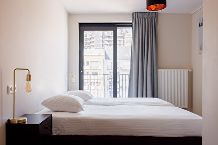 Slaapkamer in een WP Appartement in het centrum