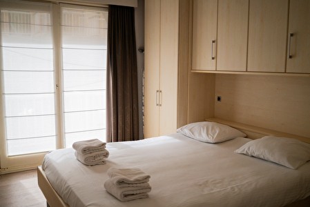 Slaapkamer in een WP Appartement Zeedijk